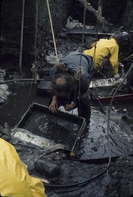 Crew excavating perishables in L9 &amp; J9 from [east]