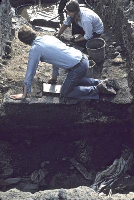 Crew excavating intrusions in I9 from west