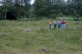 Crew standing in field