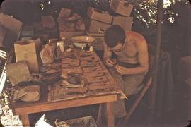 Derek Smith at work in lab tent