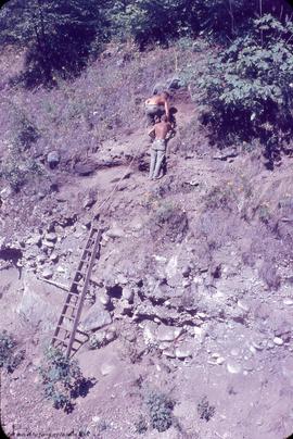 Railway cut site containing fossalized [fossilized] midden