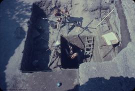 View, to N, from above, of work on deep pit. T. Denton and D. Macleod in background K. Sendey eme...